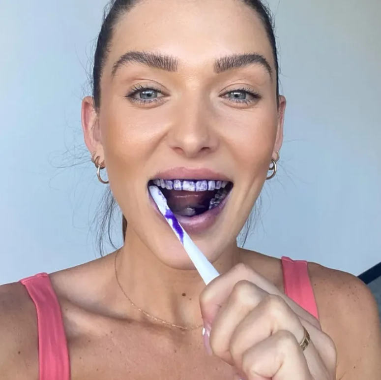 Purple Whitening Toothpaste in use